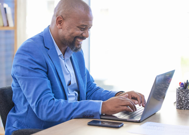 Man taking the LPI assessment at a desktop computer.